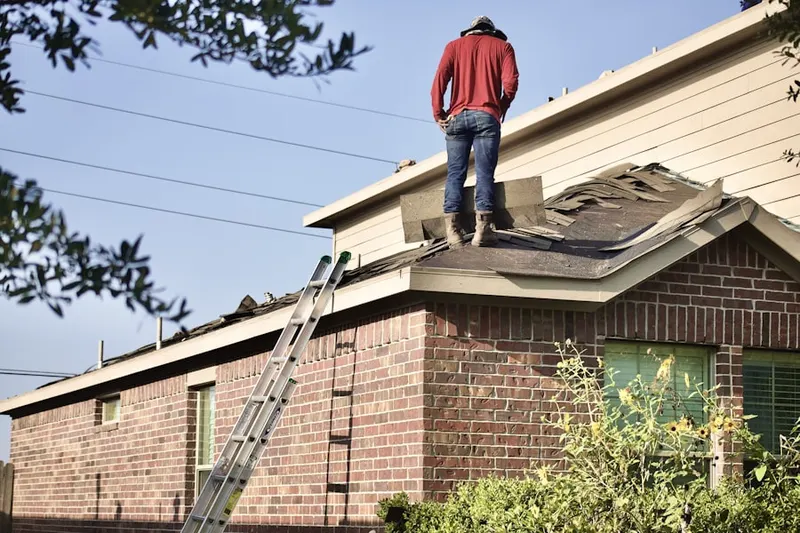 Professional roofer working on a residential roof in Catonsville